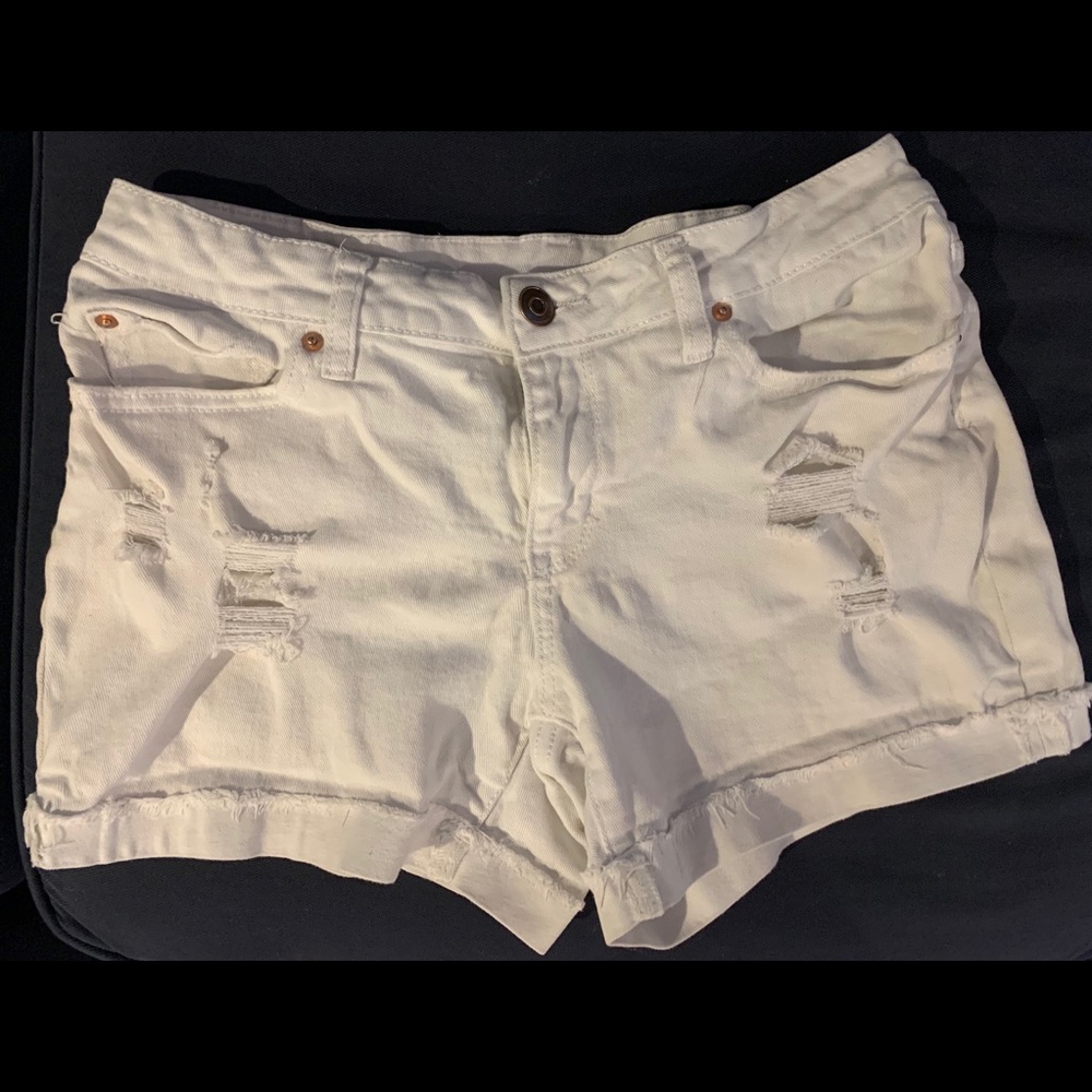 White distressed jean shorts